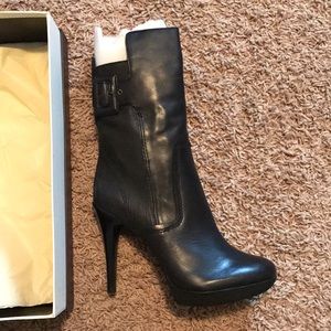 Black high heel boots.